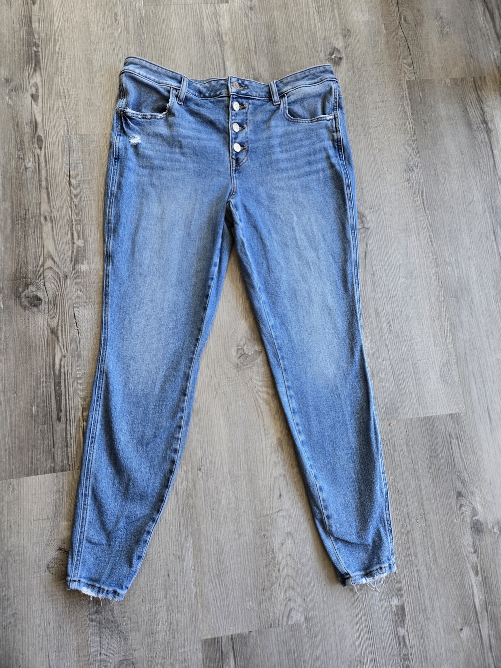 Maurices Light Blue Distressed MID-Rise Button-Fly Jeggings.